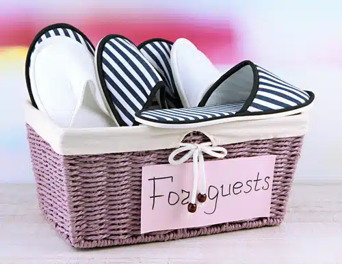 A welcome basket full of slippers