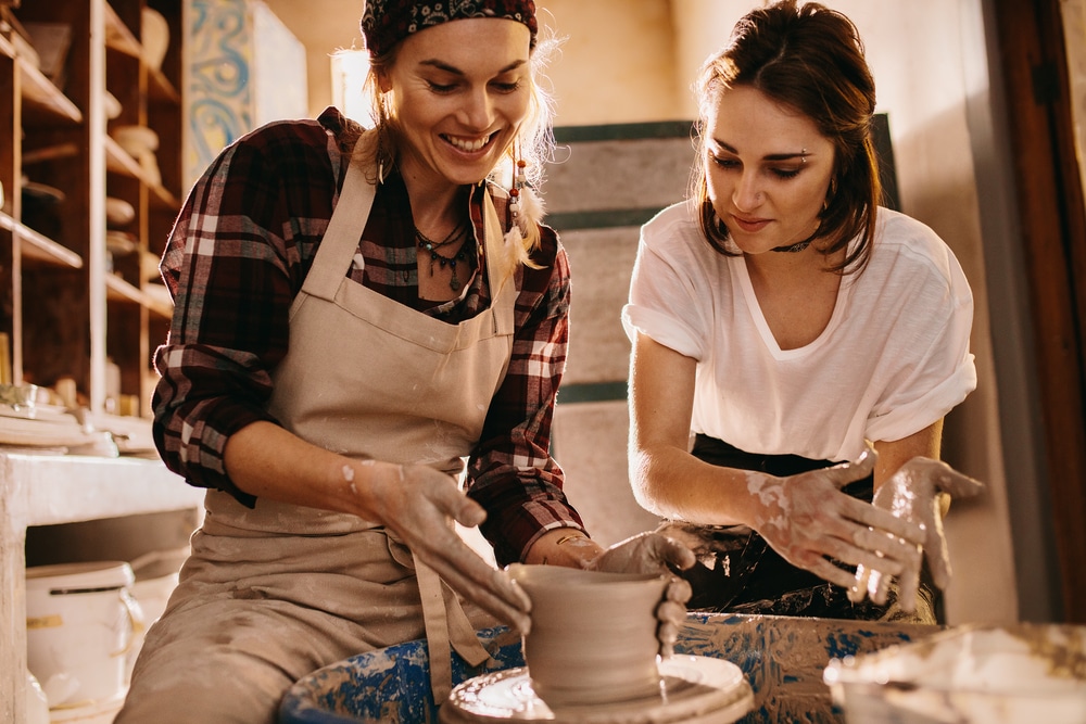 two women making pottery