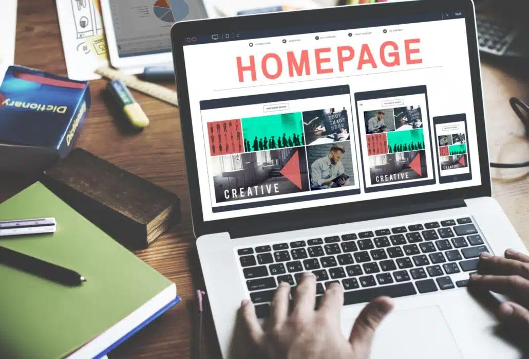 designing a homepage on a laptop