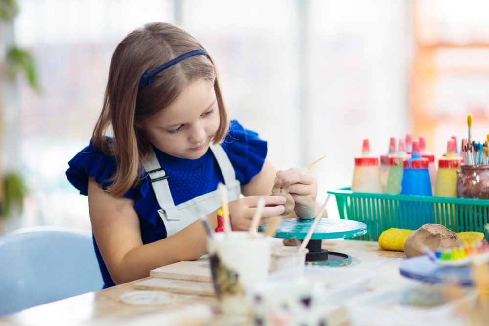 little girl doing crafts