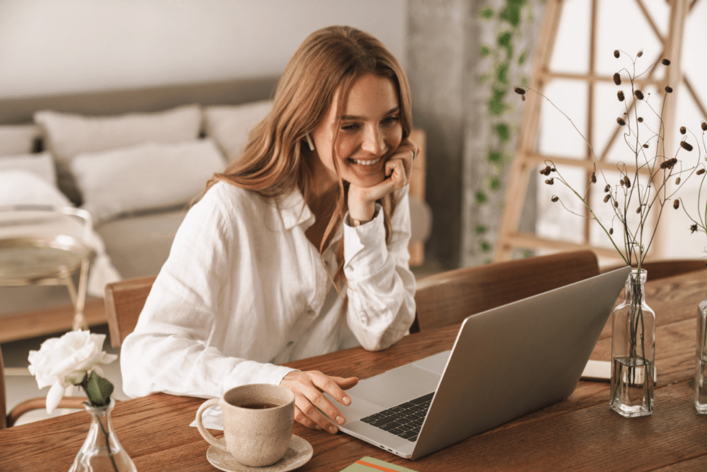 woman smiling at computer