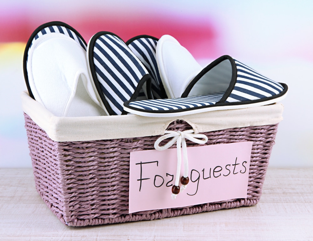 basket of slippers for guests